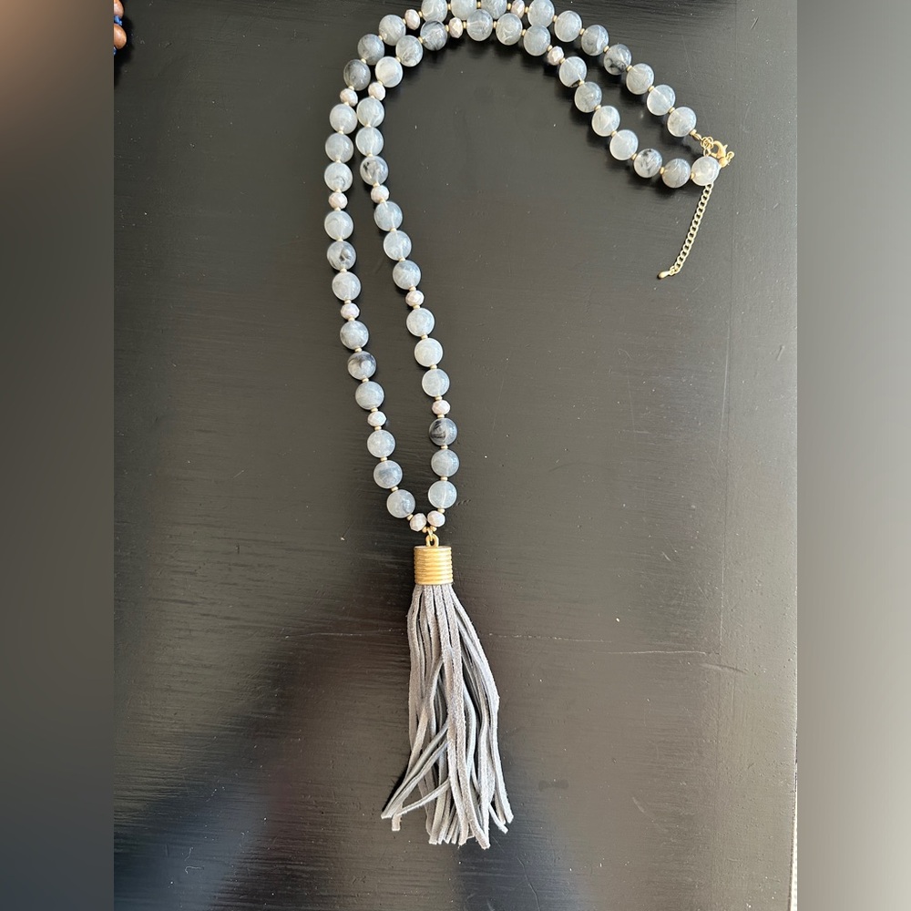 Grey bead necklace with leather tassel